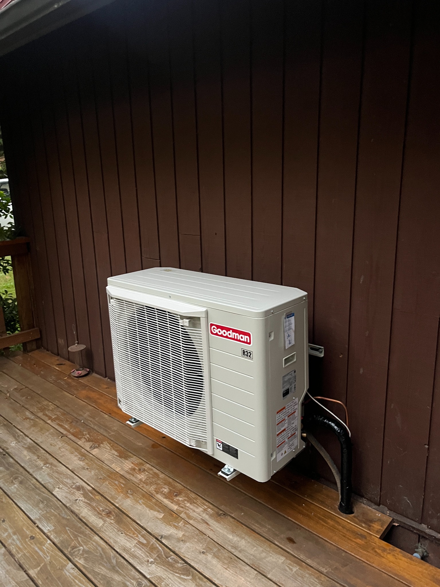 Owner-supplied photo of an outdoor unit beside wood siding